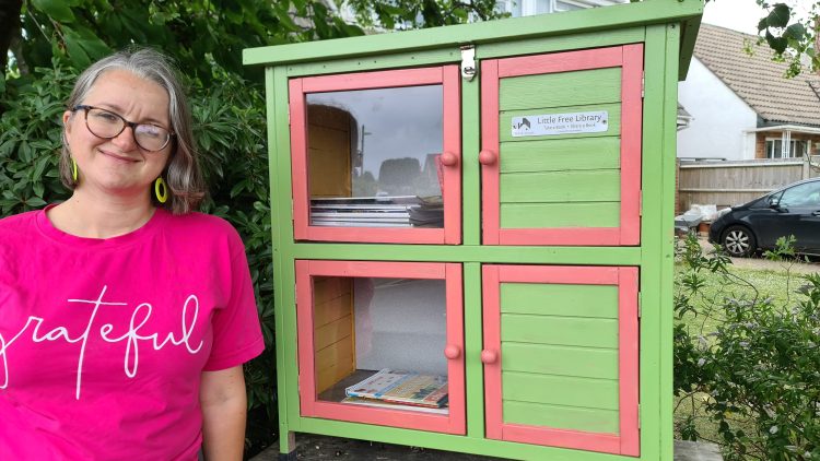 Here I am with the 'Little Free Library' the day it opened, now it is rammed all the time and has its own little life.
